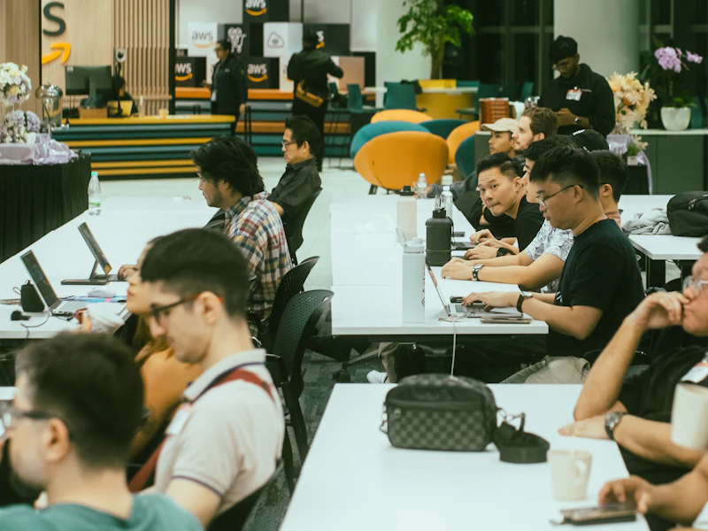 Teams building at a hackathon